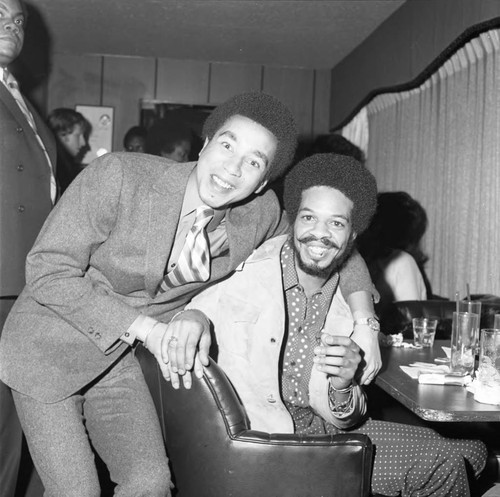 Smokey Robinson and Roland Bynum at a party, Los Angeles, 1971