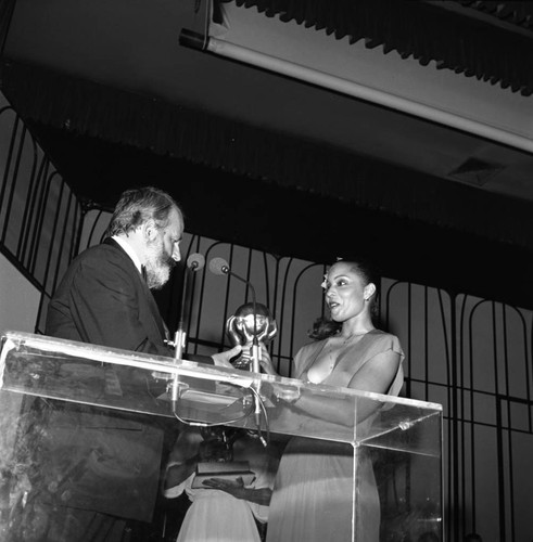 Unidentified man receiving an NAACP Image award, Los Angeles, 1978