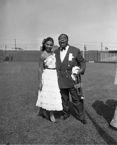 Louis Armstrong and Clara Yaeju posing together at the 9th Annual Cavalcade of Jazz, Los Angeles, 1953