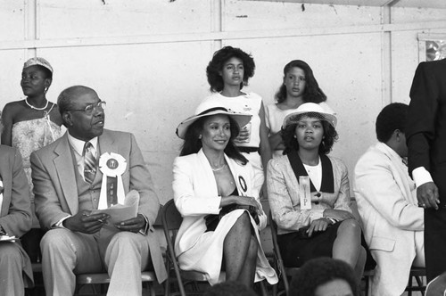 Freda Payne sitting among others during the 16th Annual Easter parade, South Central Los Angeles, 1984