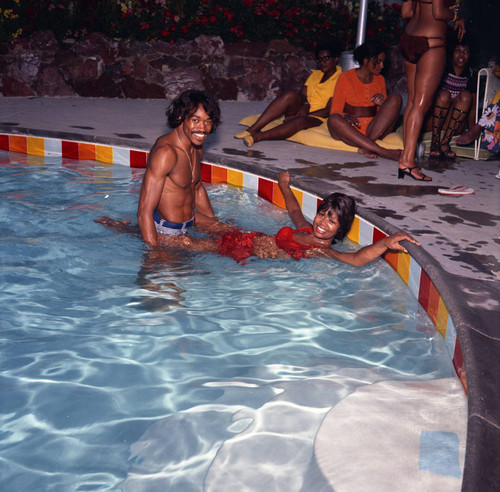 G. C. Cameron and Gwen Gordy Fuqua in the pool during a party, Los Angeles