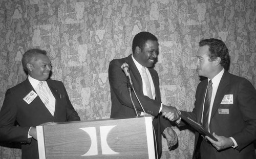 John Mack and Don Griffin presenting an award during the Urban League Career Expo, Los Angeles, 1984