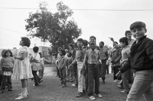 Ritter Elementary School children looking toward the sky, Watts (Los Angeles, Calif.), 1983