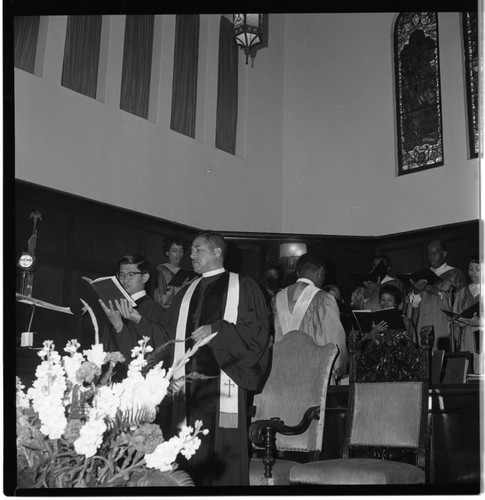 Pastor sharing his hymnal as the choir sings, Los Angeles, 1969