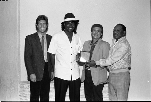 Howie Rice posing with Freddie Jett and others at the Pied Piper nightclub, Los Angeles, 1986