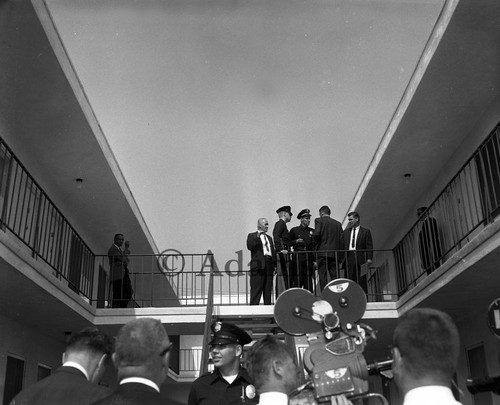 Police and press at motel, Los Angeles, 1964