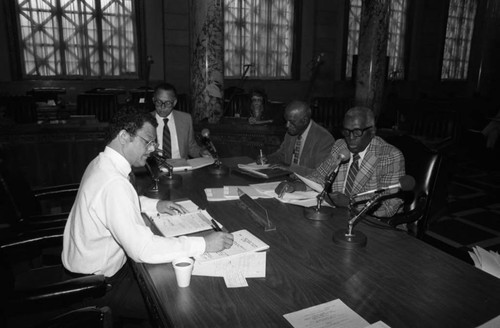 Robert Farrell listening to testimony at City Hall on red lining, Los Angeles, 1985