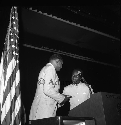 Bradley presenting plaque, Los Angeles, 1982