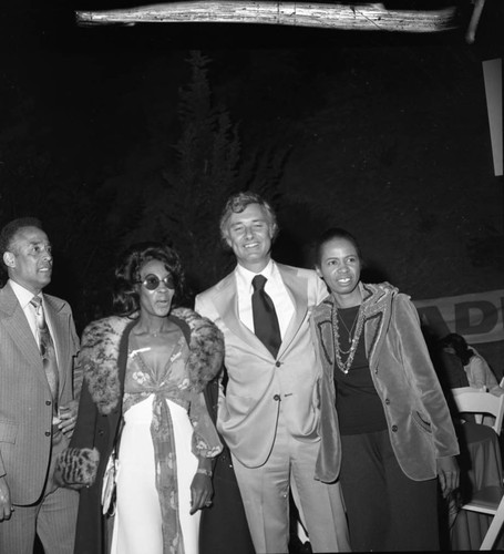 Arnett Hartsfield standing with others at an event in support of the Bradley mayoral campaign, Los Angeles, 1973