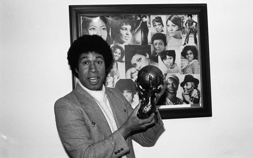 Man posing with an NAACP Image Award, Los Angeles, 1978