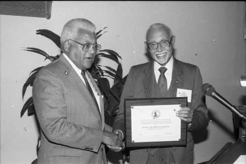 Rev. James Lawson presenting a plaque to Rev. Thomas Kilgore at a Southern Christian Leadership Conference event, Los Angeles, 1989