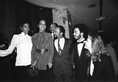 Quincy Jones talking with Peggy Lipton, James Ingram and others at a Neighbors of Watts benefit, Los Angeles, 1982