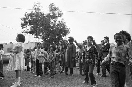 Ritter Elementary School children looking toward the sky, Watts (Los Angeles, Calif.), 1983