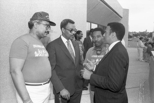 Andrew Young speaking with anti-drug rally participants, Inglewood, California, 1986