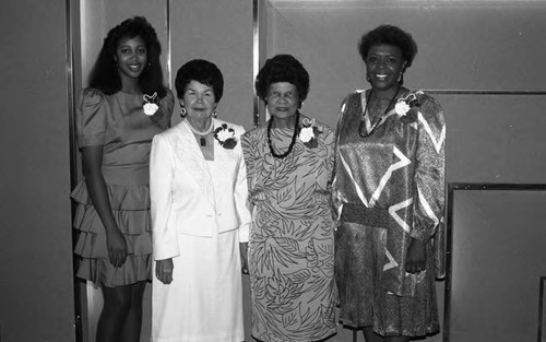 Dr. Geraldine Woods and Miriam Matthews posing with others at the Los Angeles Alumnae Chapter, Delta Theta Sigma September breakfast, Los Angeles, 1989