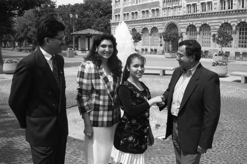 California Chicano News Media Association award recipient shaking hands with Félix Gutiérrez, Los Angeles, 1994