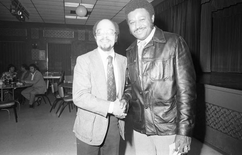 Hillard Hamm posing with an unidentified man, Compton, 1973