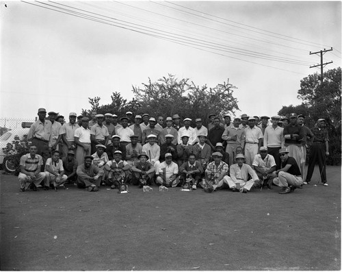 Men on golf course, Los Angeles