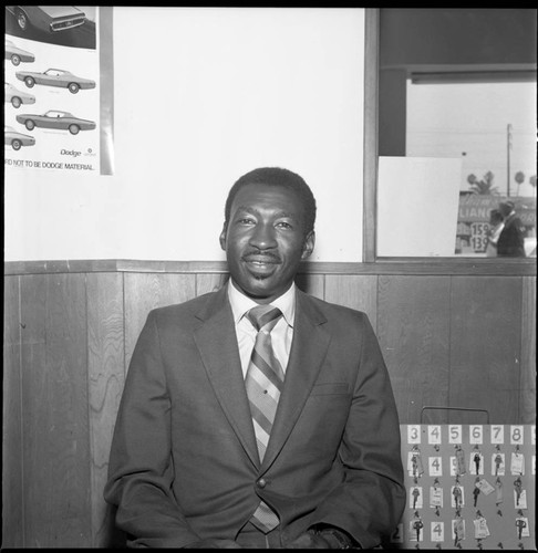 African American automobile salesman posing for a portrait, Los Angeles, 1971