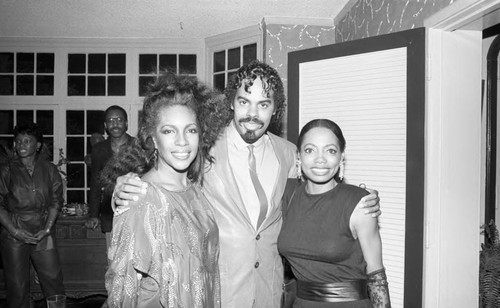 Mary Wilson posing with Florence LaRue at her birthday party, Los Angeles, 1985