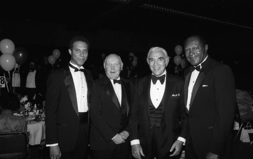 Douglas Dollarhide, Robert O. Anderson, Lorne Green, and Tom Bradley posing together, Los Angeles, 1985