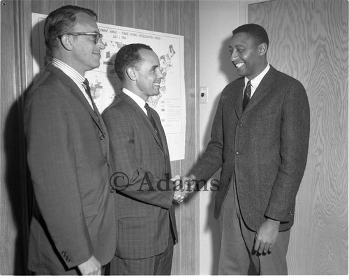 Shaking hands, Los Angeles, 1964