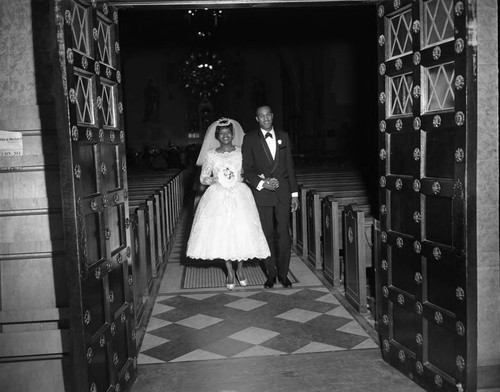 Bride and groom exits church, Los Angeles, 1962