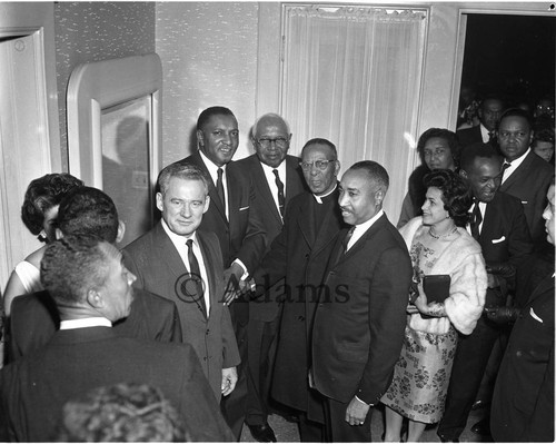 Greeting guests, Los Angeles, 1963