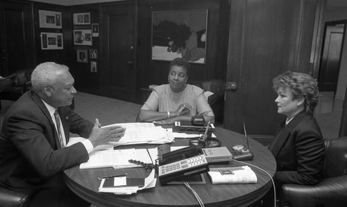 John W. Mack talking with women in the Urban League office, Los Angeles, 1991