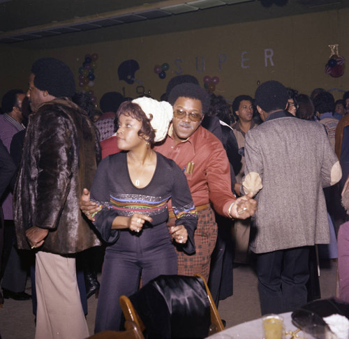 Guy Crowder dancing with his wife at a Super Bowl party, Los Angeles, 1977