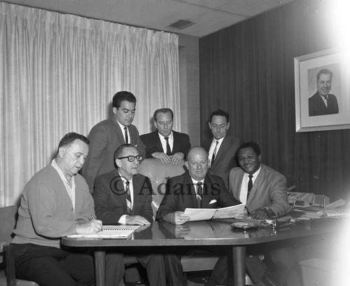 Men seated at desk, Los Angeles, 1968