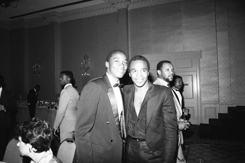 Isaiah Thomas and Sugar Ray Leonard posing together at Magic Johnson's birthday party, Los Angeles, 1985