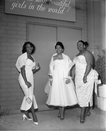 Hair stylists posing together during a fashion and hair show at Ciro's, Los Angeles, 1957