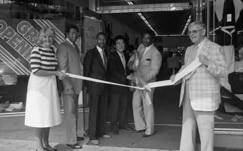 Angie's Dress Shop ribbon cutting participants posing together, Los Angeles, 1983