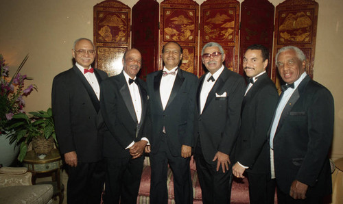 Six men in tuxedos posing together at a formal event, Los Angeles, 1994