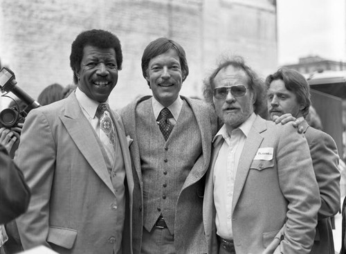 Hal Williams, Richard Chamberlain, and Bill Bushnell posing together at the Los Angeles Theater Center building site, Los Angeles, 1983