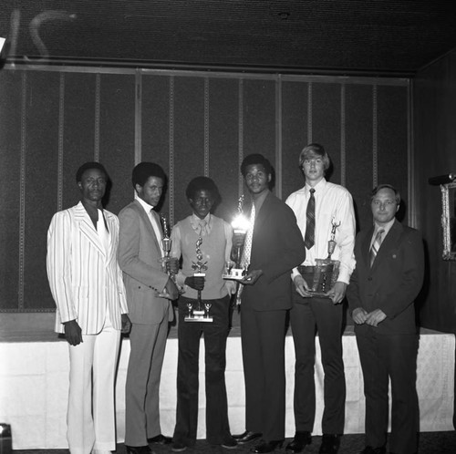 Compton College basketball trophy recipients posing together, Hawthorne, California 1973