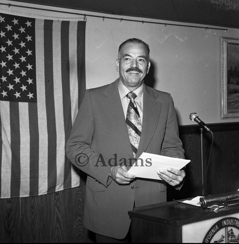 Man at podium, Los Angeles, 1972