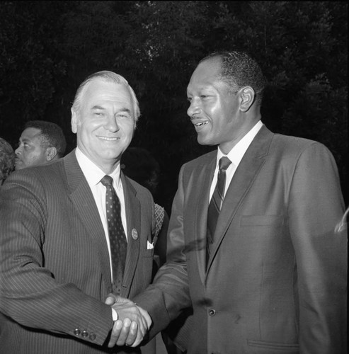 Tom Bradley shaking hands with Alphonzo Bell, Jr., Los Angeles, 1969