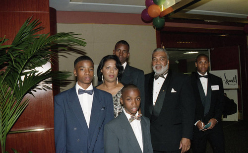 Victor M. Julien posing with others during "A Midsummer's Night Magic"event, Beverly Hills, 1994