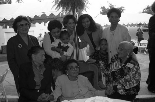 Marie Claiborne posing with others on a patio, Los Angeles, 1995