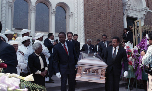 Pall bearers carrying the casket of Jessie Mae Beavers during her funeral, Los Angeles, 1989