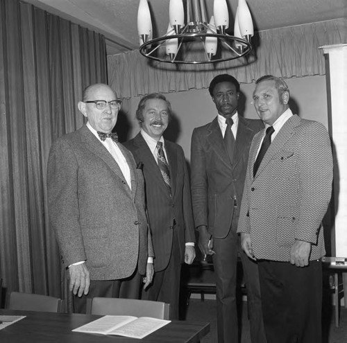 Men posing together during an event at Compton College, Los Angeles, ca. 1972