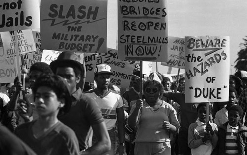 Crowd marching in a parade during a celebration of Dr. Martin Luther King's birthday, Los Angeles, ca. 1987