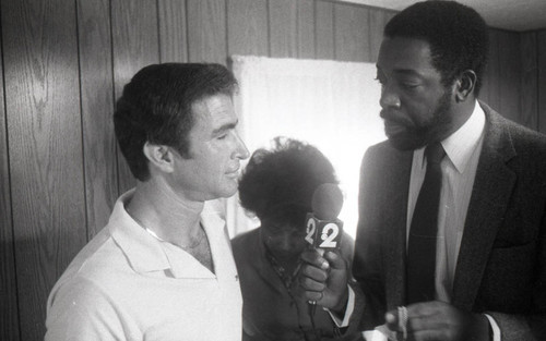 Reporter interviewing a recruiter for ABC Market, Los Angeles, 1983