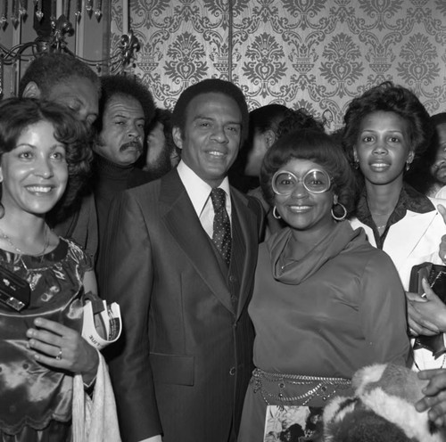 Andrew Young posing with others at a Brotherhood Crusade dinner, Los Angeles, 1978