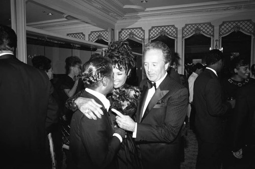 Sammy Davis, Jr., Diahann Carroll, and Vic Damone talking at the Black Emmy nominees dinner, Los Angeles, 1989