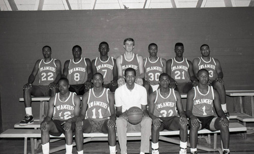 Jamaal Wilkes posing with a young basketball team, Los Angeles, ca. 1988