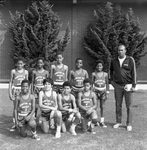 Compton basketball team posing for a group portrait, Los Angeles, 1971