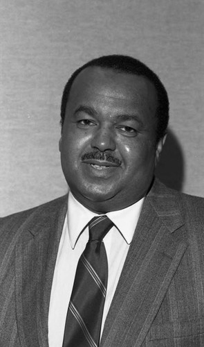 An unidentified African American man posing for the camera during an event, Los Angeles, 1989